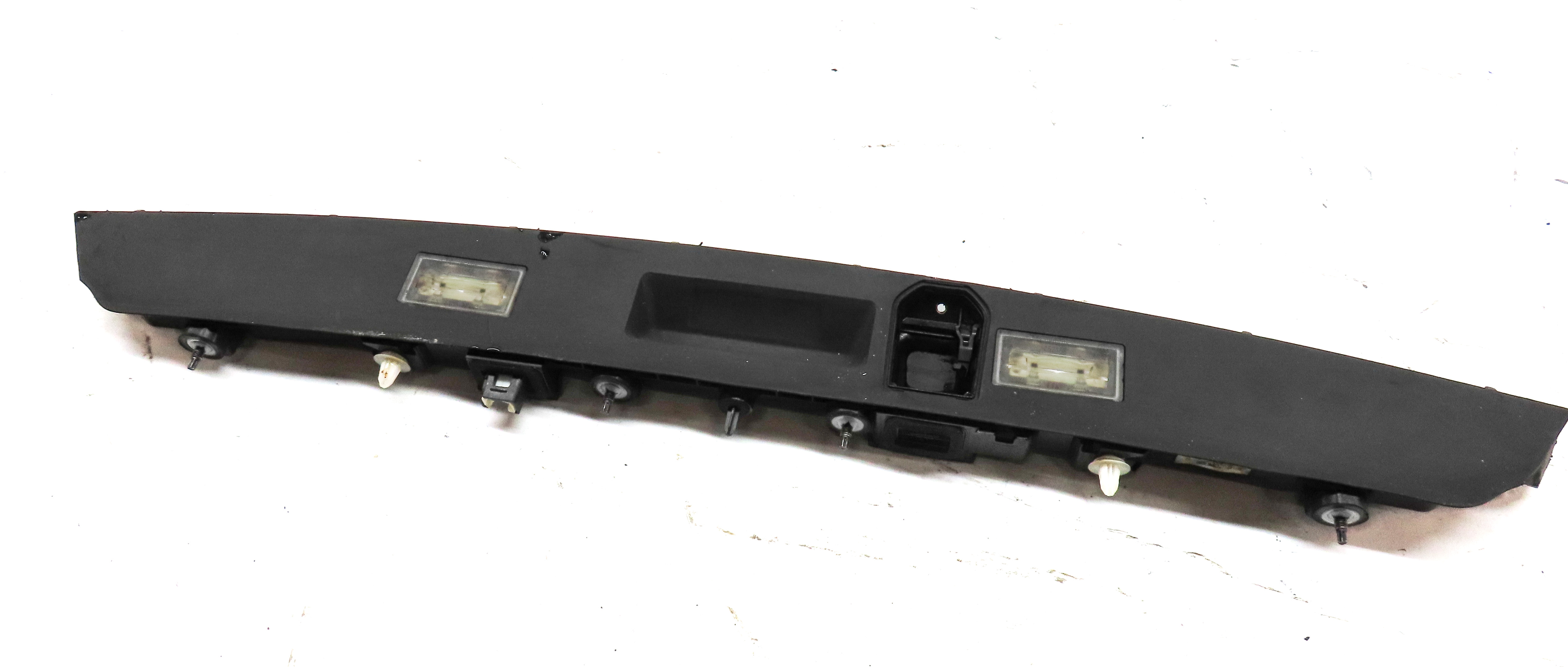 2016 BMW 750i (G11) REAR TRUNK LICENSE PLATE LIGHT TRIM PANEL w/ HANDLE — exact item pictured
